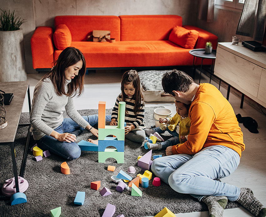 Family building blocks on the ground of living room