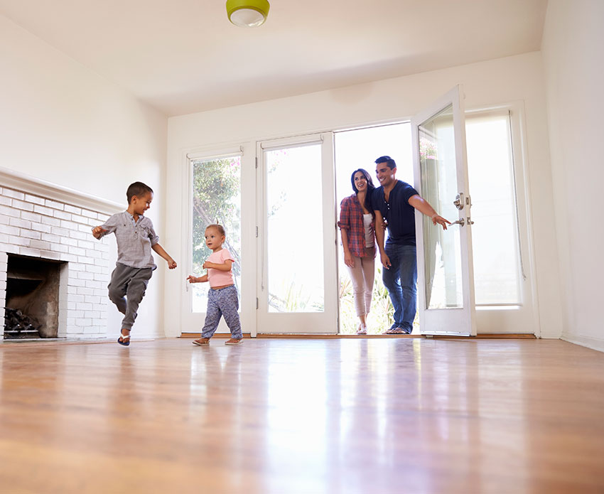 Family walking inside their home they purchased with a home loan from Greater Nevada Mortgage