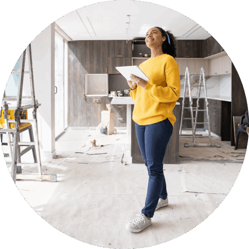 Woman holding a tablet walking in a home improvement zone